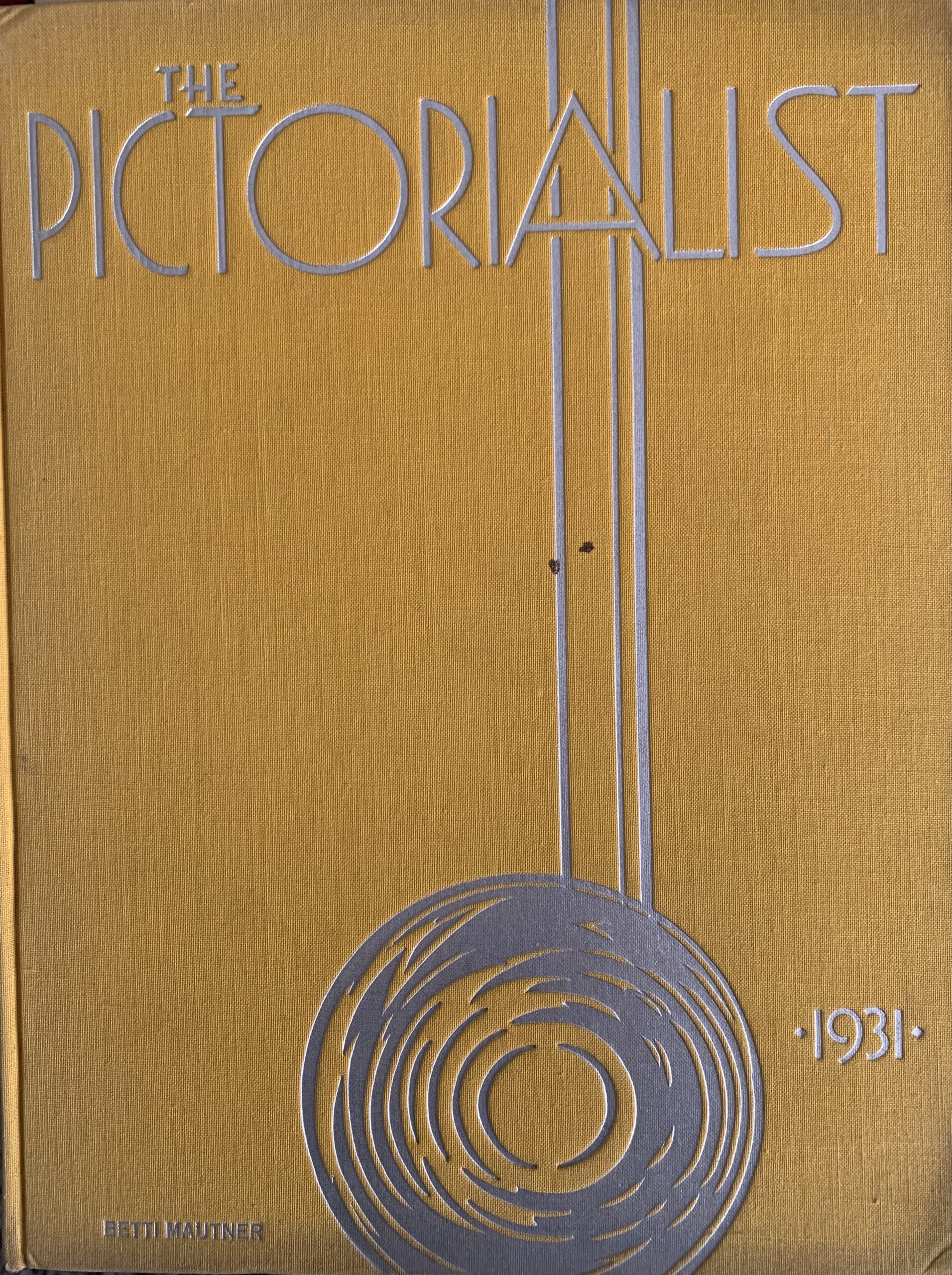 The Pictorialist photobook by Betti Mautner. Published 1931. Image courtesy of James Hyman. The yellow cover of the book is seen.