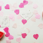 3 seed hearts with candles and pink confetti