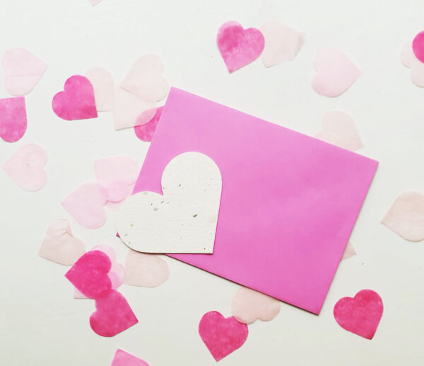 Seed Heart with envelope and pink heart-shaped confetti