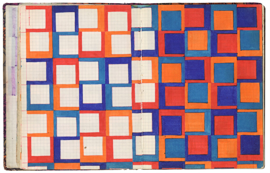 Double page spread of square-papered notebook, covered in inked blue, orange, red and purple squares.