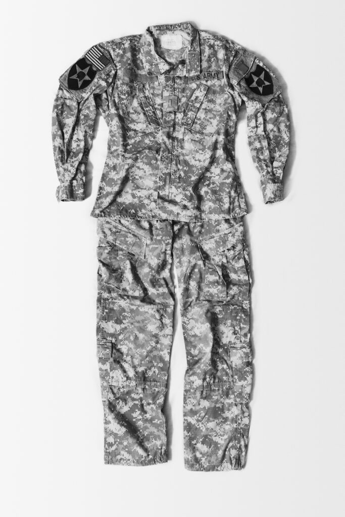 Black and white photograph of a United States military uniform, laid out flat.