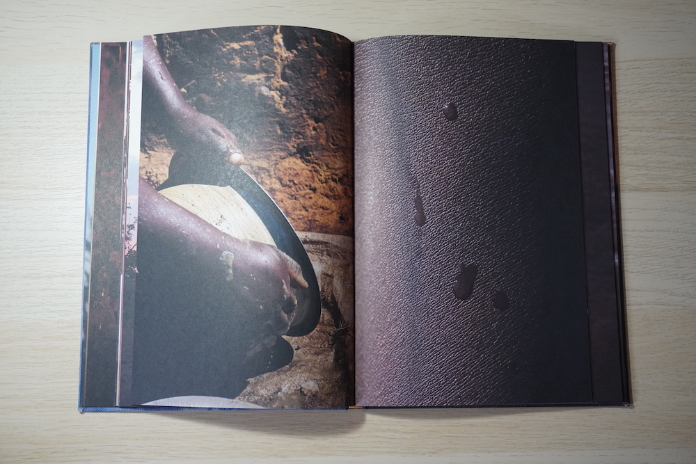 Double page spread. Left: Hands cleaning a pot. Right: Water droplets on skin.