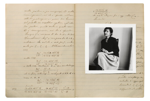 Double page spread of a lined notebook. On the right side page is a square, black and white photograph of a woman sitting on a chair.