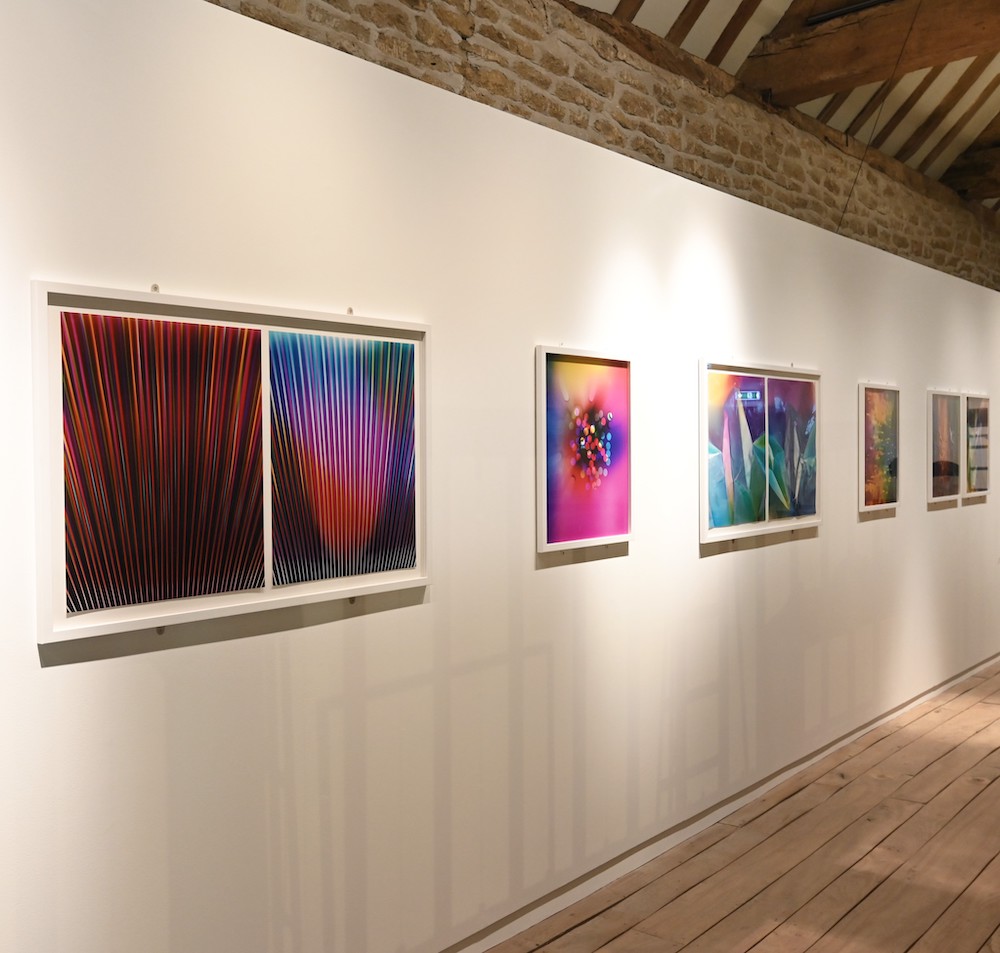 Installation image showing work by Ellen Carey on the wall of the Fox Talbot Museum.